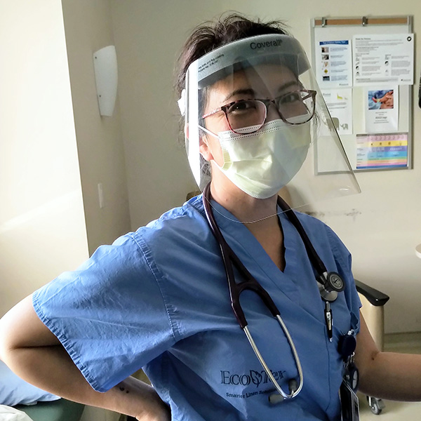 Midwife and AOM President Jasmin Tecson in hospital wearing mask and face shield