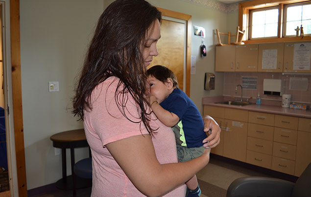 Photo of mom and baby in clinic room at Six Nations birth centre.