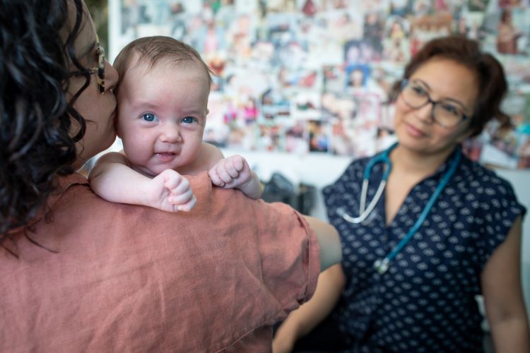 Midwifery client and baby at postpartum clinic visit with Midwife Jasmin Tecson